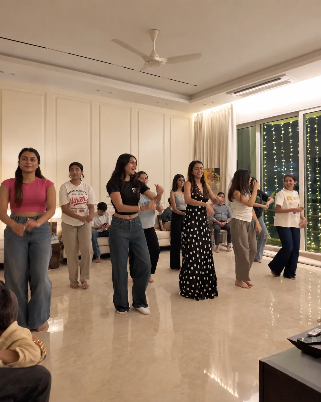 Group practising dance choreography during a wedding and Sangeet rehearsal